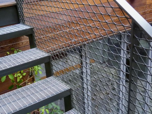 Flattened expanded metal infill panels are used to built outdoor handrails.