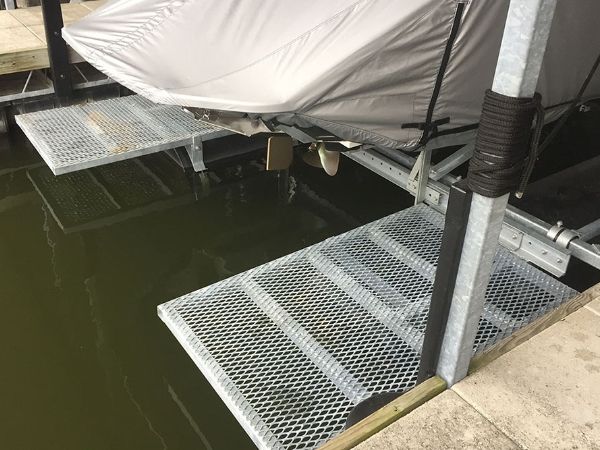 2 white expanded metal dock decks are installed on the dock.